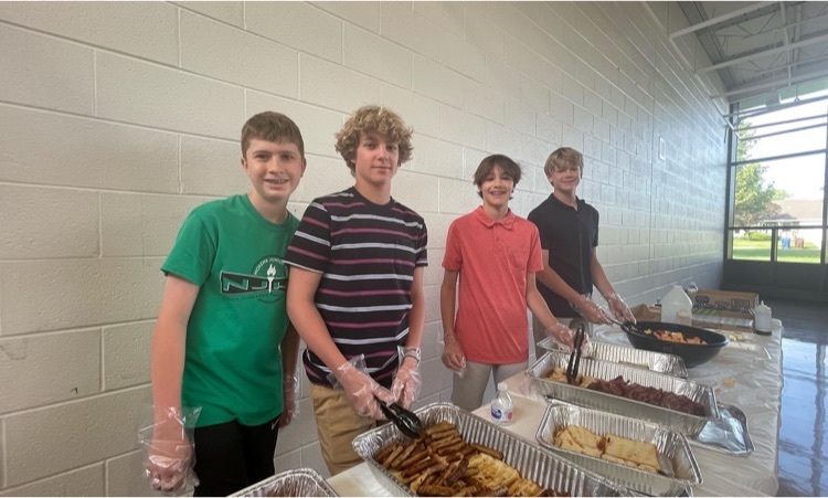 7th grade NJHS members serving breakfast 