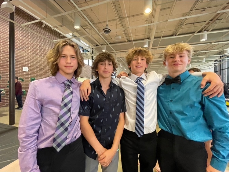 students dressed up at the 8th grade dance 