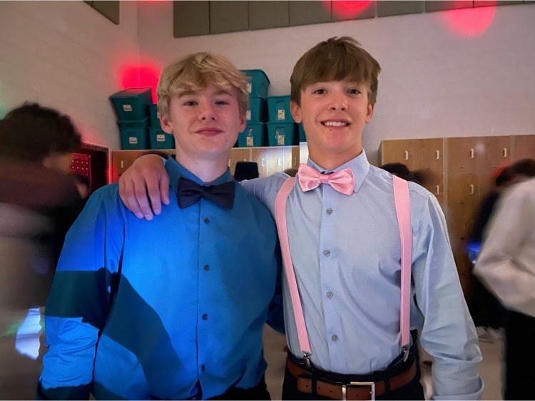students dressed up at the 8th grade dance 