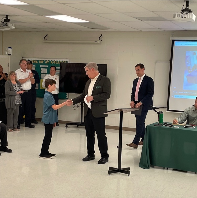 student receiving plaque 