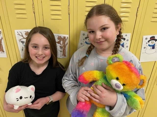 students with stuffed animals 